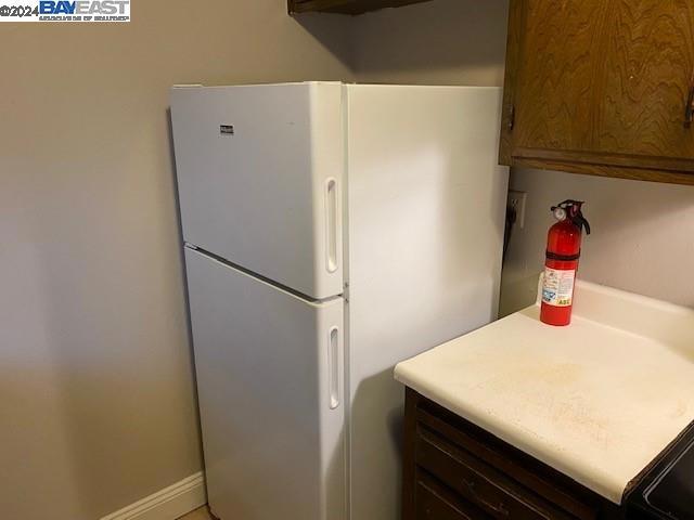 kitchen featuring white fridge