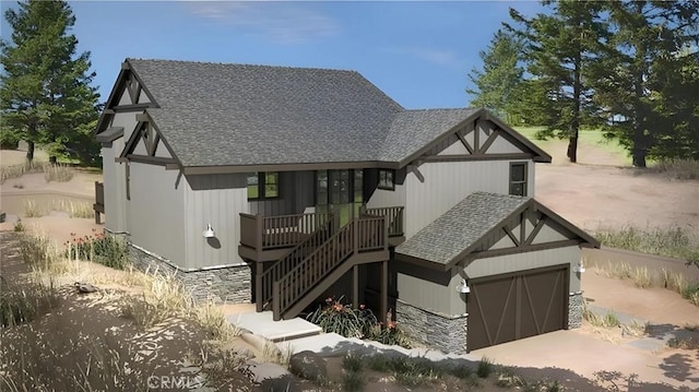 tudor-style house with stone siding, a shingled roof, stairs, and an attached garage