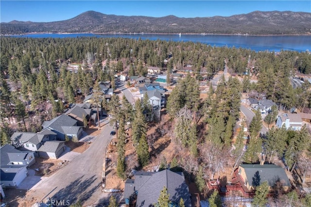 drone / aerial view with a water and mountain view