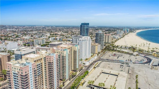 aerial view with a water view and a view of the beach