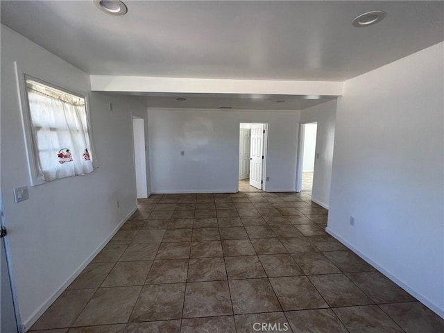 foyer entrance featuring dark tile patterned flooring