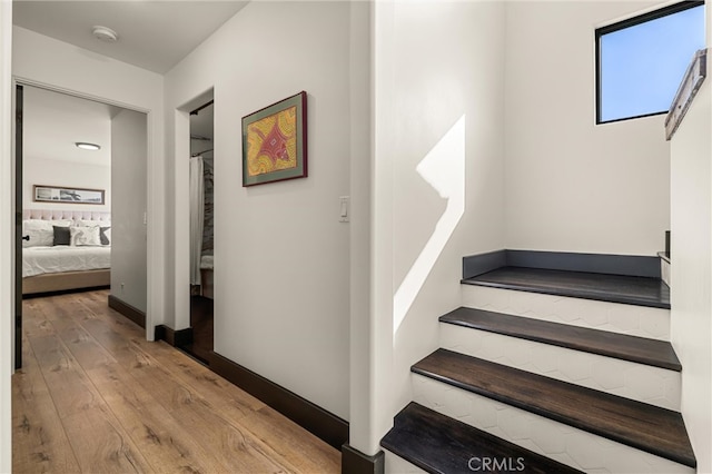 stairs with wood-type flooring