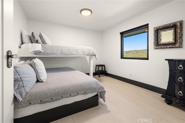 bedroom with light hardwood / wood-style floors