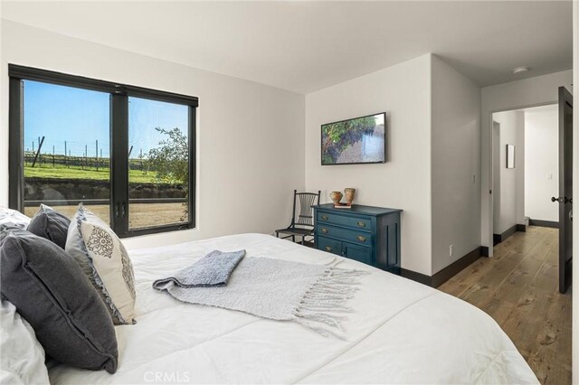 bedroom featuring dark wood-type flooring