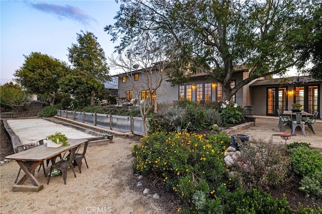 view of yard with a patio area and french doors