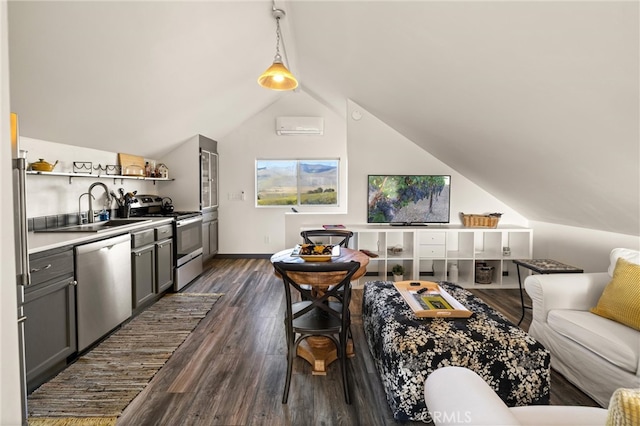 living room featuring dark wood-type flooring, sink, an AC wall unit, and lofted ceiling