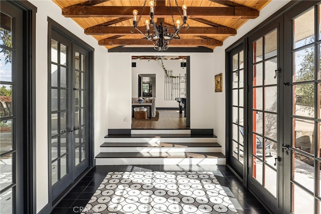 unfurnished sunroom with a notable chandelier, wooden ceiling, lofted ceiling with beams, and french doors