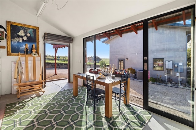 dining room with lofted ceiling