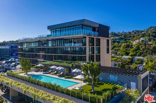 view of property featuring a community pool