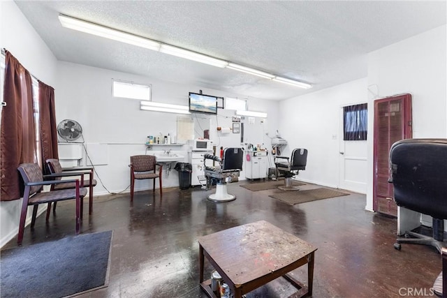 office space with sink and a textured ceiling