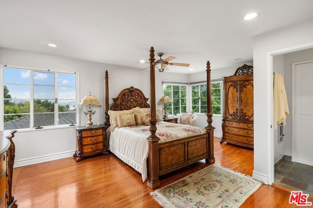 bedroom with tile floors and ceiling fan