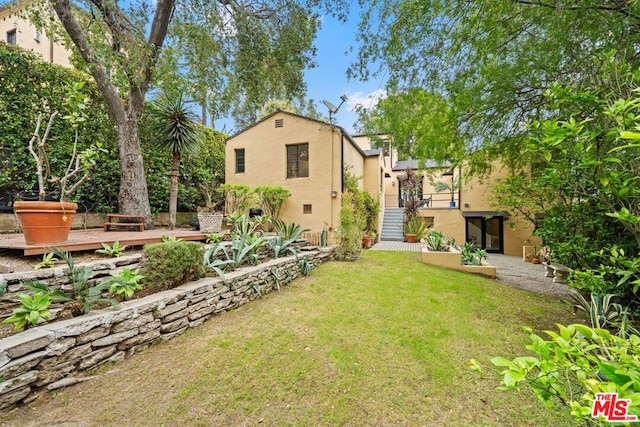 view of yard featuring a deck