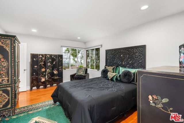 bedroom featuring wood-type flooring