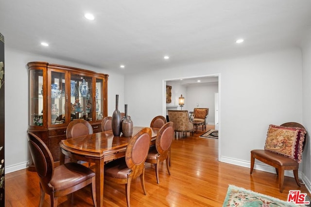 dining area with light hardwood / wood-style floors