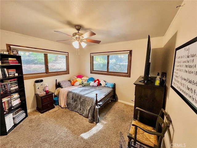 bedroom with carpet floors, ceiling fan, and ornamental molding