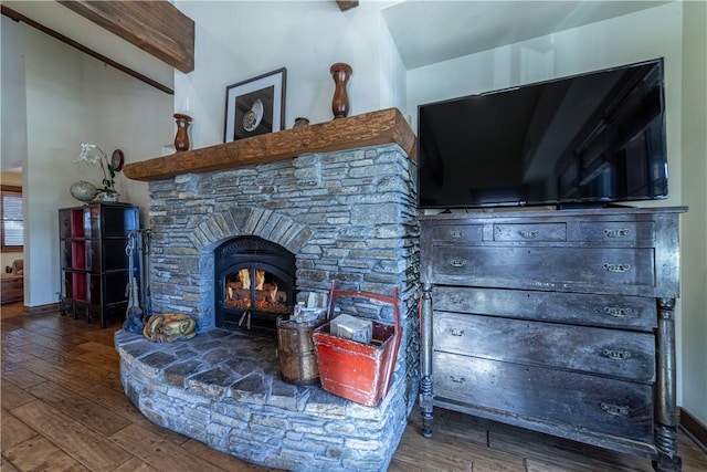 living room featuring hardwood / wood-style floors and beamed ceiling