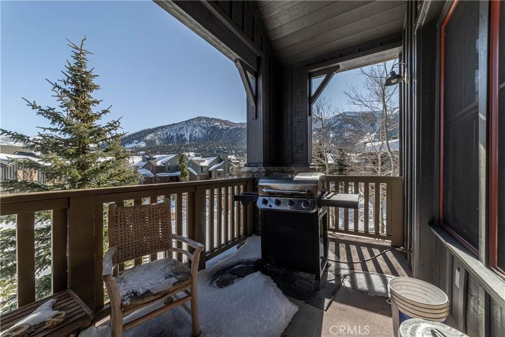 balcony featuring area for grilling and a mountain view