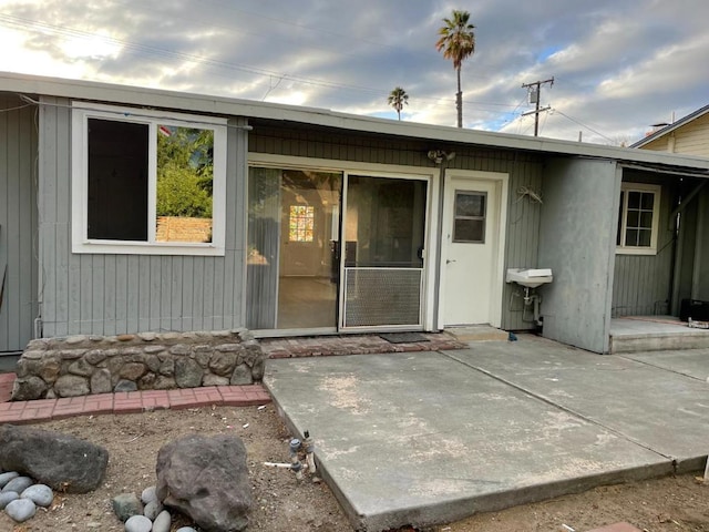 rear view of house featuring a patio