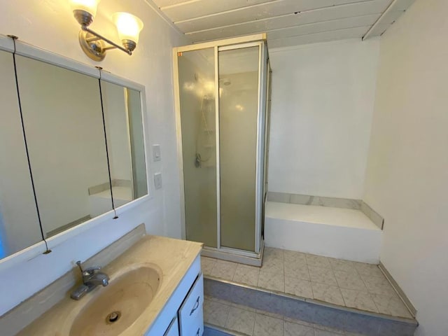 bathroom featuring independent shower and bath and vanity