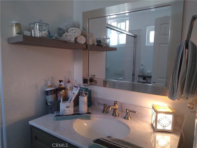 40672 Corte Albara, Murrieta, CA 92562 - bathroom featuring vanity and an enclosed shower