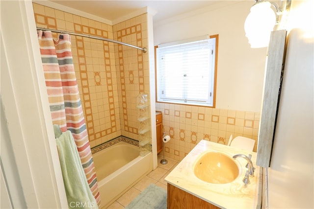 bathroom featuring vanity, shower / bath combo with shower curtain, tile walls, tile patterned flooring, and ornamental molding