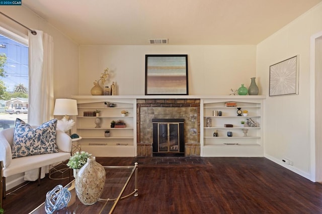 living room with a fireplace and hardwood / wood-style floors