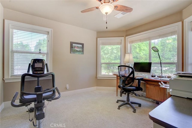 carpeted home office with ceiling fan