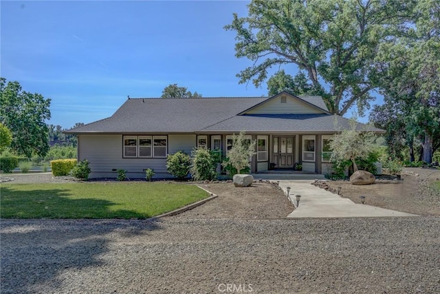 ranch-style house with a front lawn