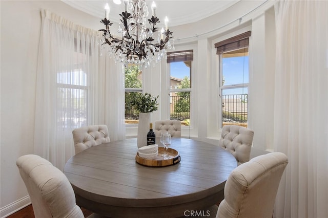 dining area featuring an inviting chandelier