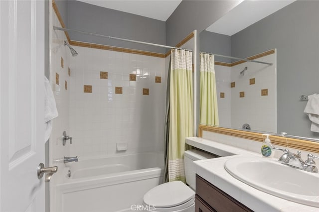 full bathroom with vanity, shower / tub combo, and toilet