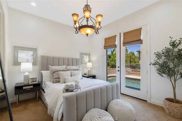 bedroom featuring an inviting chandelier, light carpet, and access to outside