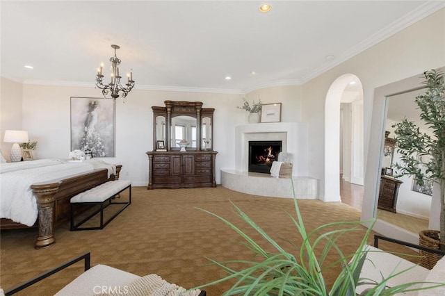 bedroom with light carpet, ornamental molding, and a chandelier