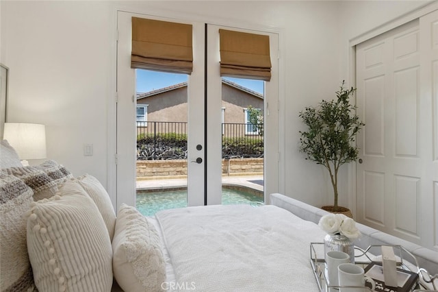 bedroom featuring access to outside and french doors