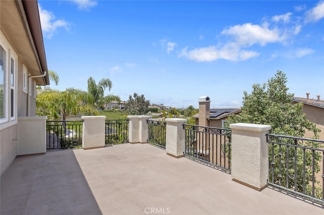 view of patio / terrace with a balcony