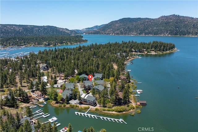 aerial view featuring a water and mountain view