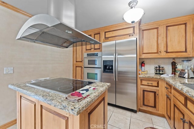 kitchen with island exhaust hood, appliances with stainless steel finishes, decorative backsplash, light stone countertops, and light tile patterned flooring