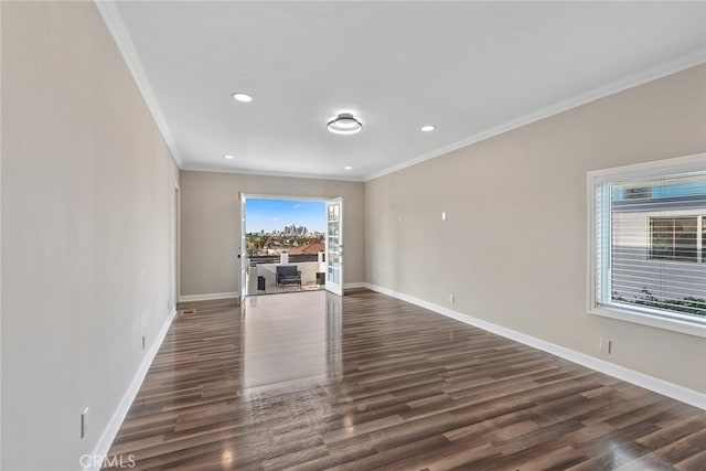 unfurnished living room featuring crown molding and dark hardwood / wood-style flooring