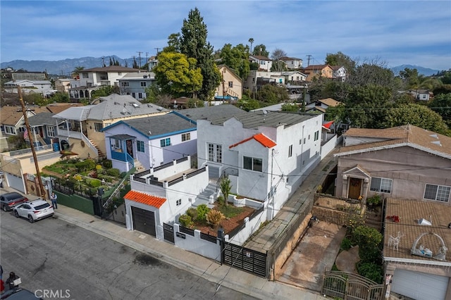 birds eye view of property featuring a mountain view