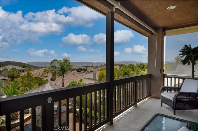 balcony featuring a mountain view