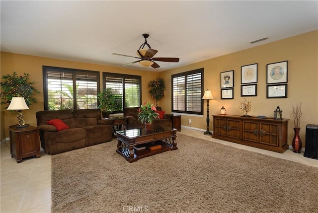 tiled living room with ceiling fan