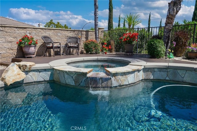 view of pool featuring an in ground hot tub