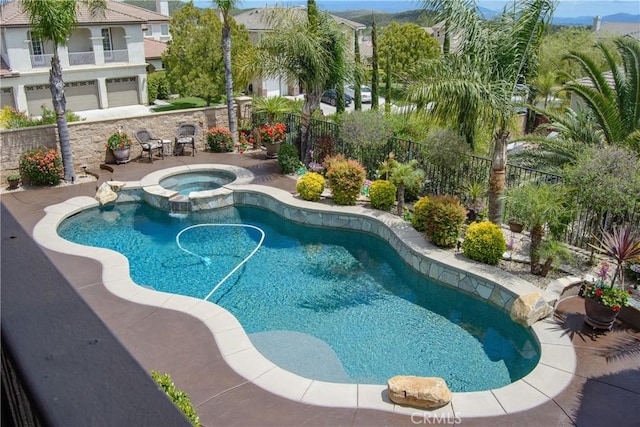 view of pool featuring an in ground hot tub and a patio area