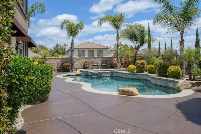 view of swimming pool with a patio area