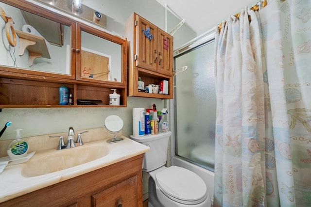 full bathroom with vanity, shower / bath combination with curtain, and toilet