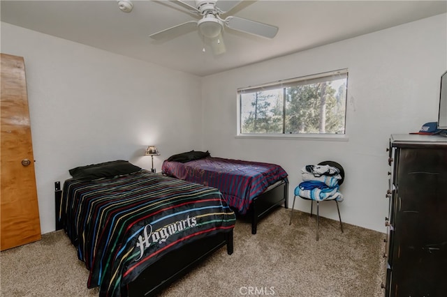 bedroom with light colored carpet and ceiling fan