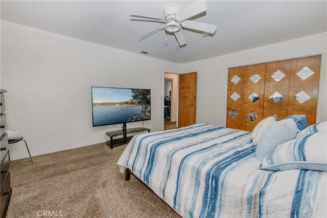 bedroom featuring ceiling fan and light carpet