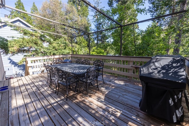 wooden terrace featuring area for grilling