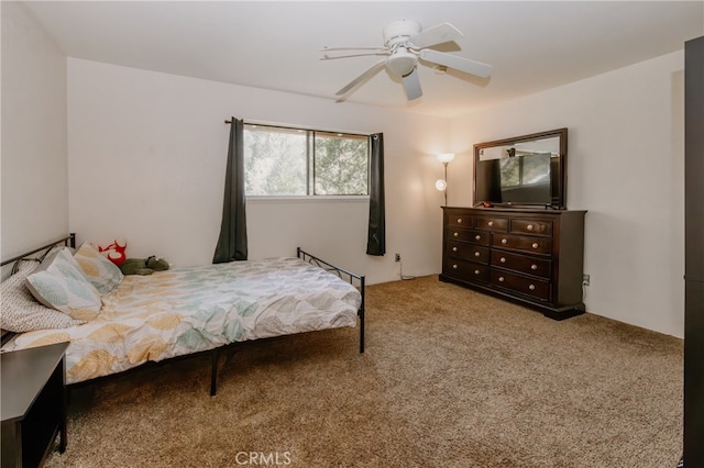 bedroom featuring ceiling fan and carpet floors