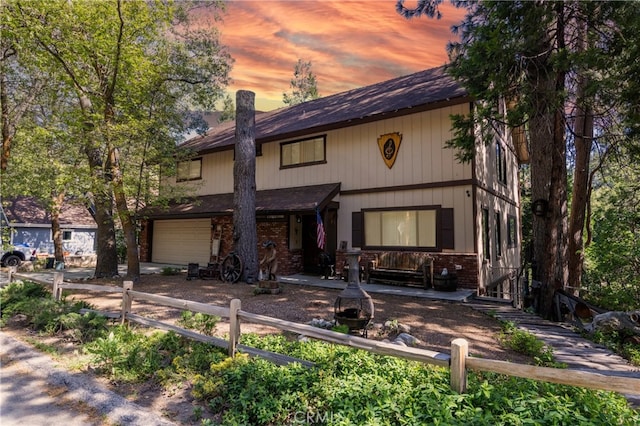 view of front of house featuring a garage and covered porch