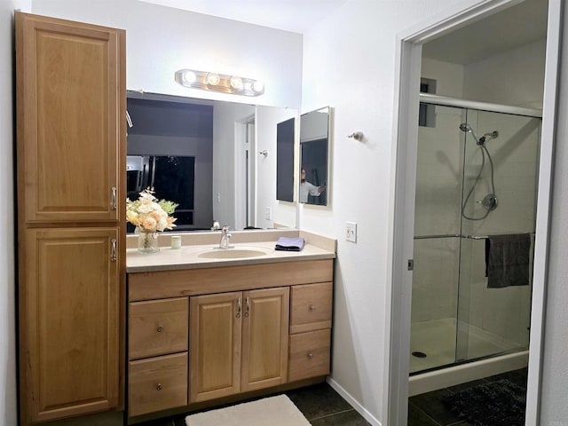 bathroom with vanity, tile patterned floors, and an enclosed shower